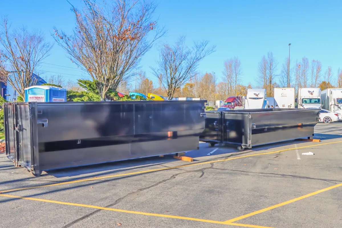 Professional dumpster rental service with roll-off container on residential driveway in Rolling Hills Estates